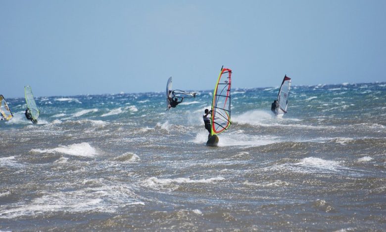 Windsurfers on a choppy Aegean shore
